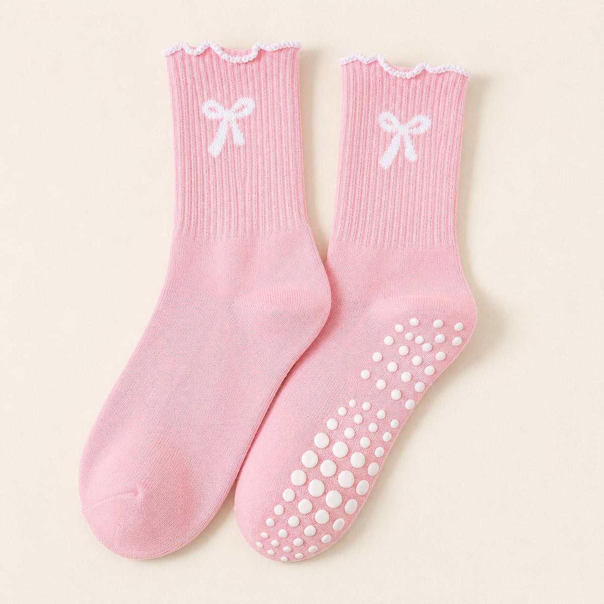 Single pair of blush ruffle bow grip socks